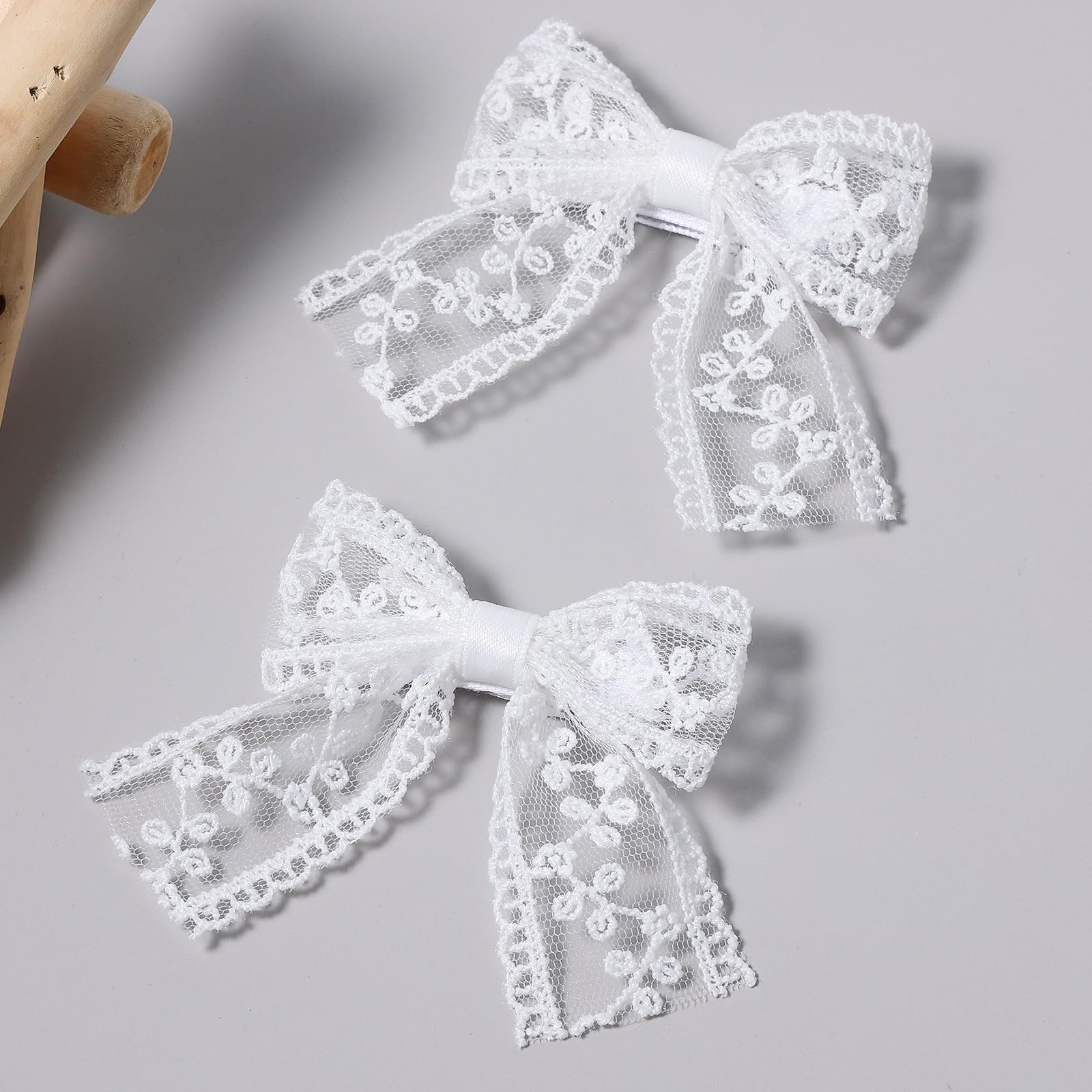 Miroksh white lace bow long-tail clip closeup for wedding-ready hairstyle.