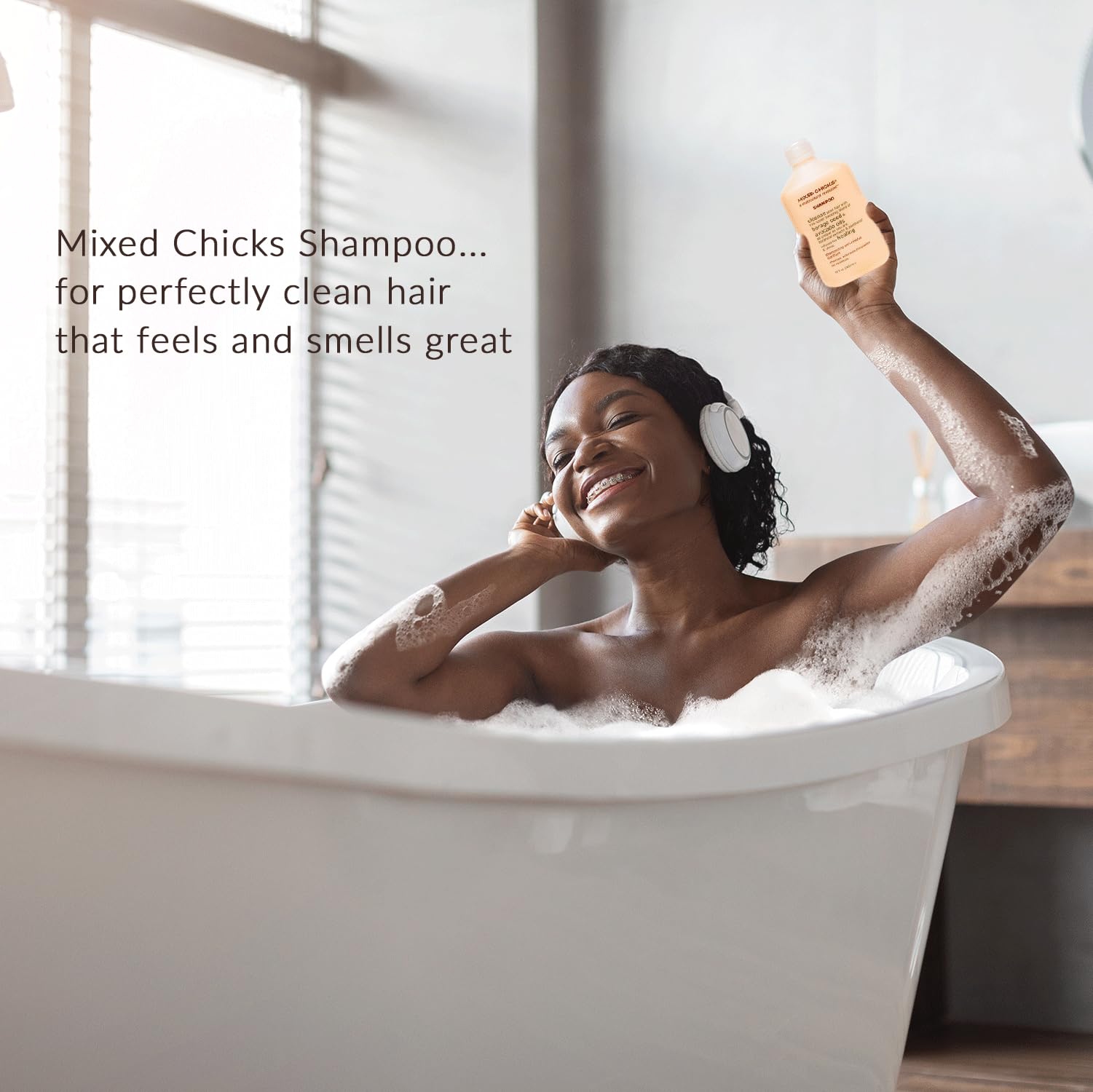 Mixed Chicks Gentle Clarifying Shampoo in shower with damp hair for effective cleansing.
