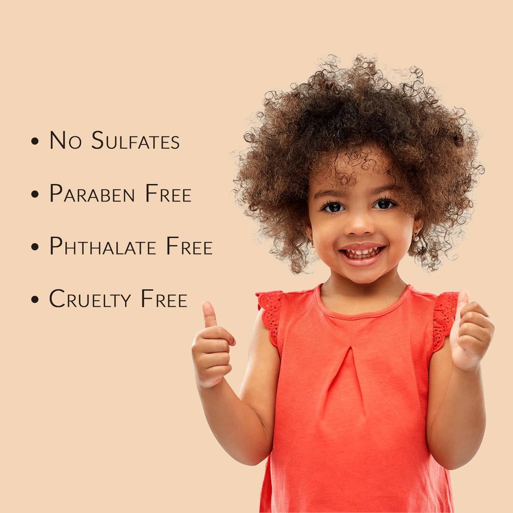 Close-up of Mixed Chicks Kids Tangle Tamer formula on damp curls for frizz control.