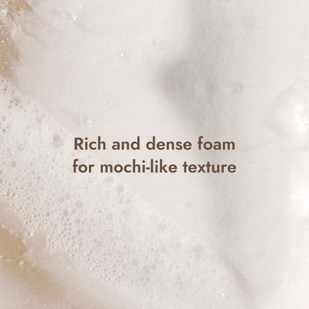 MIZON Snail Repairing Foam Cleanser exfoliation-action closeup demonstrates gentle dead skin removal.