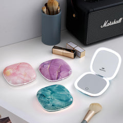 Mocado compact LED travel mirror showing 10X magnification for precise detail work.