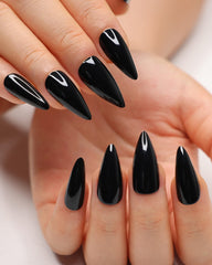 Morily black press-on nails in stiletto almond shape ready for dramatic day-to-night looks.