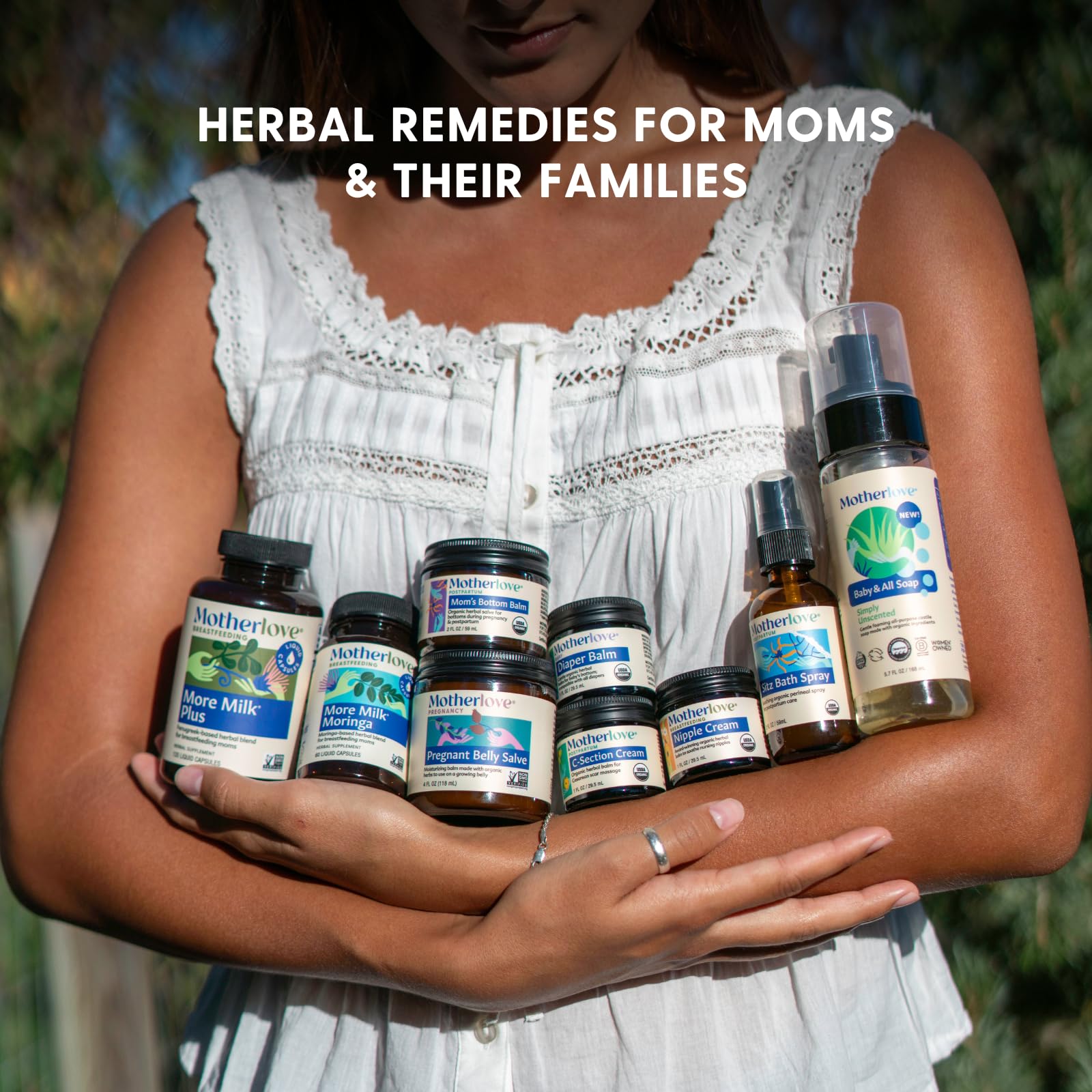 Motherlove Pregnant Belly Oil organic herbs display highlights lavender and rosehips.