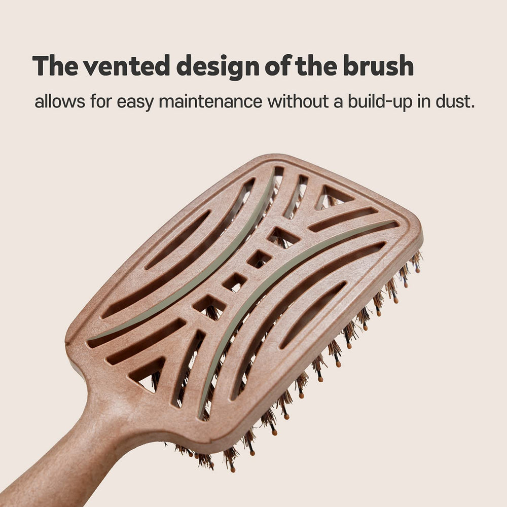 Mother's Corn Yao Boar Bristle Brush works well with oils for even distribution.