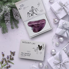 Mount Lai Amethyst Gua Sha on skin demonstrates smooth glide for contouring.