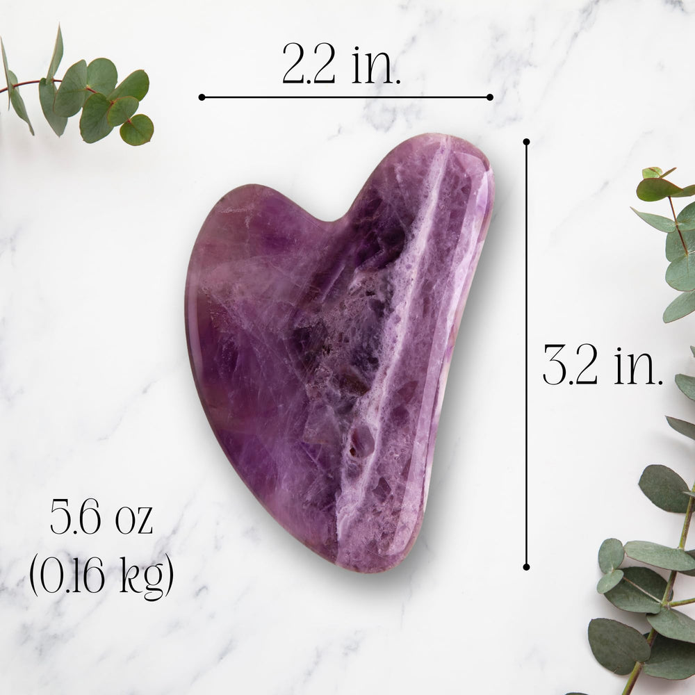 Mount Lai Amethyst Gua Sha with serum for optimal glide.