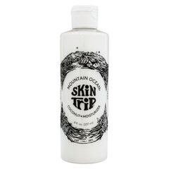Mountain Ocean Skin Trip coconut body lotion bottle promotes quick absorption for daily hydration.