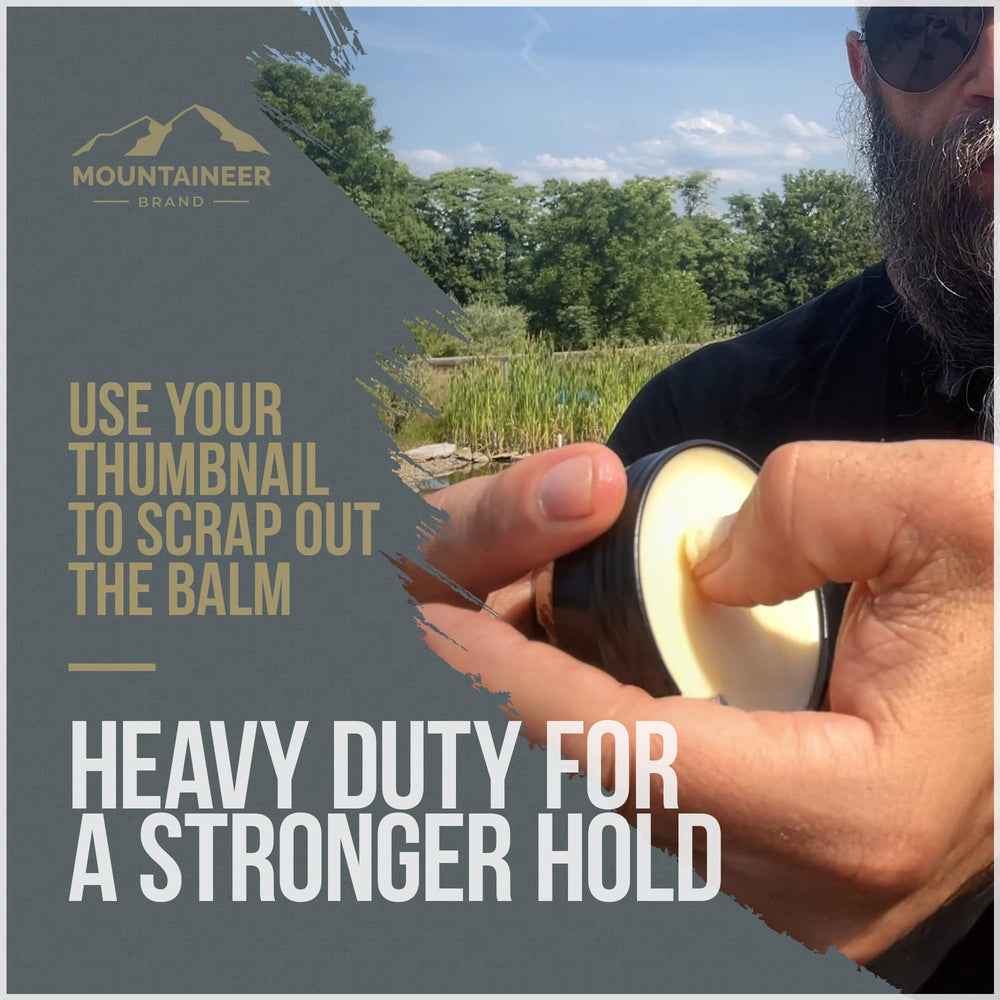 Mountaineer Brand user applying balm on hands and beard for conditioning.