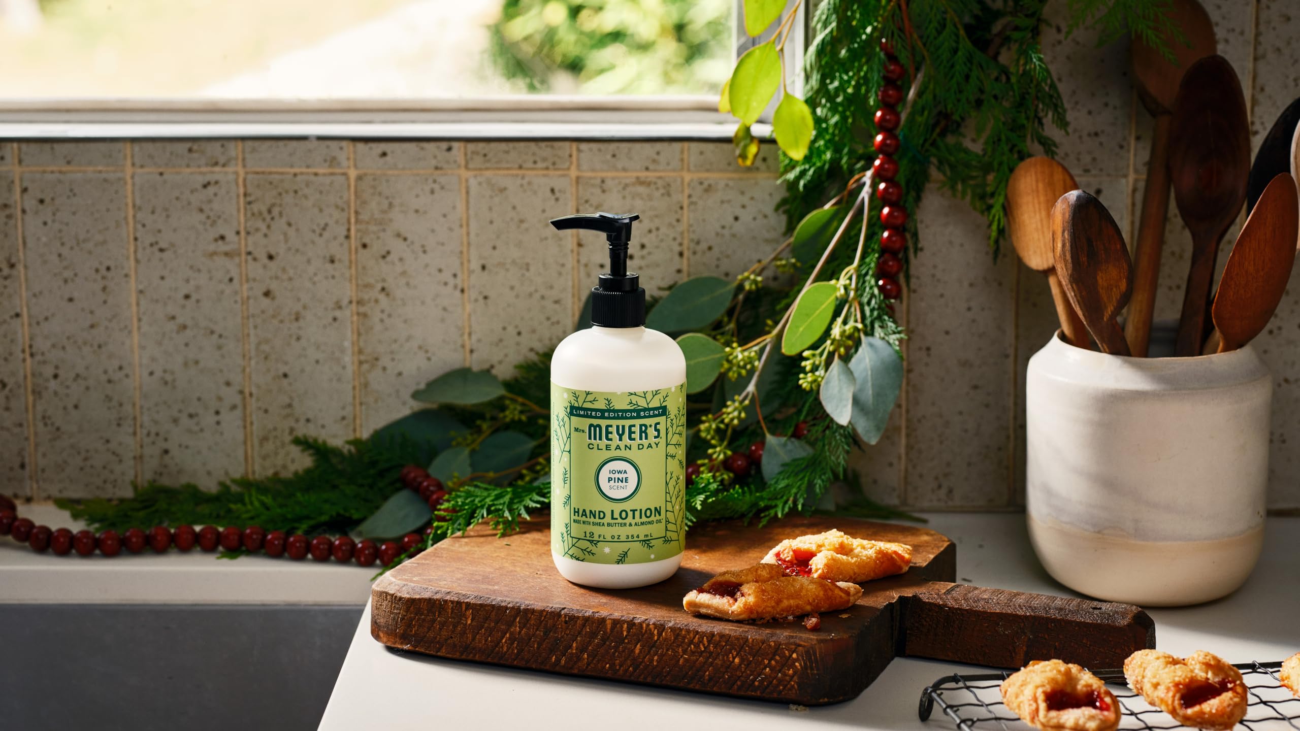 Application scene of Mrs. Meyer's Iowa Pine lotion emphasizing pine scent.