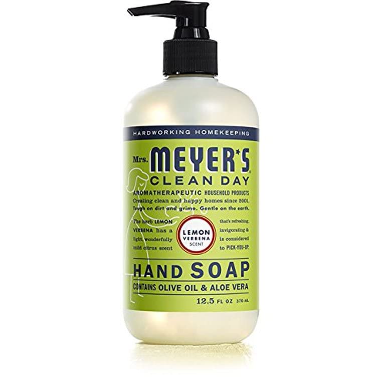 Mrs. Meyer's Clean Day Hand Soap moisturizing hands while washing at sink.