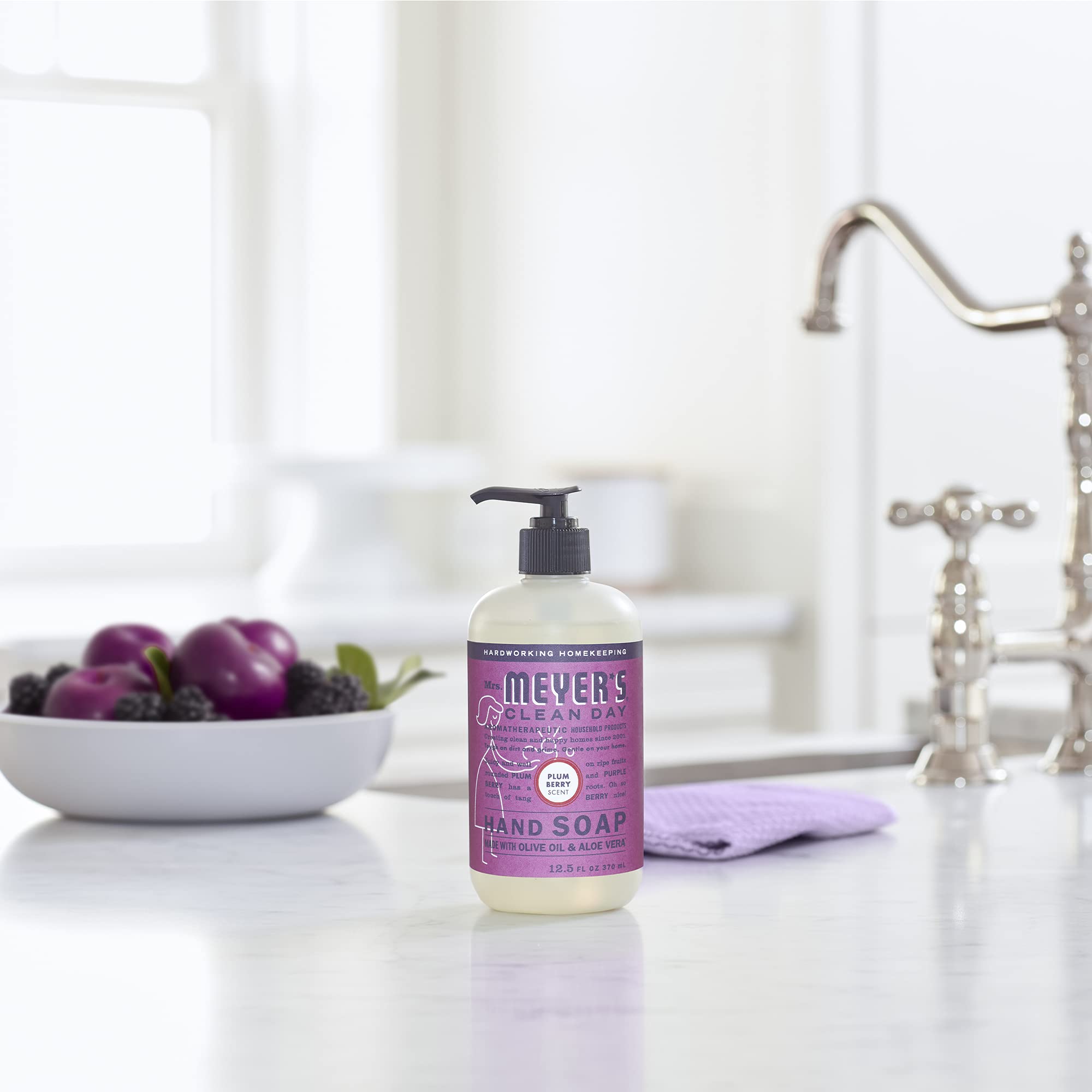 Mrs. Meyer's Plum Berry hand soap dispensing action shows easy, mess-free use