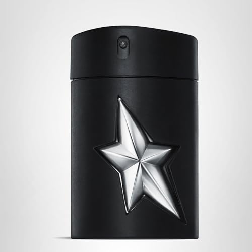 Mugler A*Men Fantasm bottle in hand suggests travel-ready fragrance with confident, long-lasting scent.