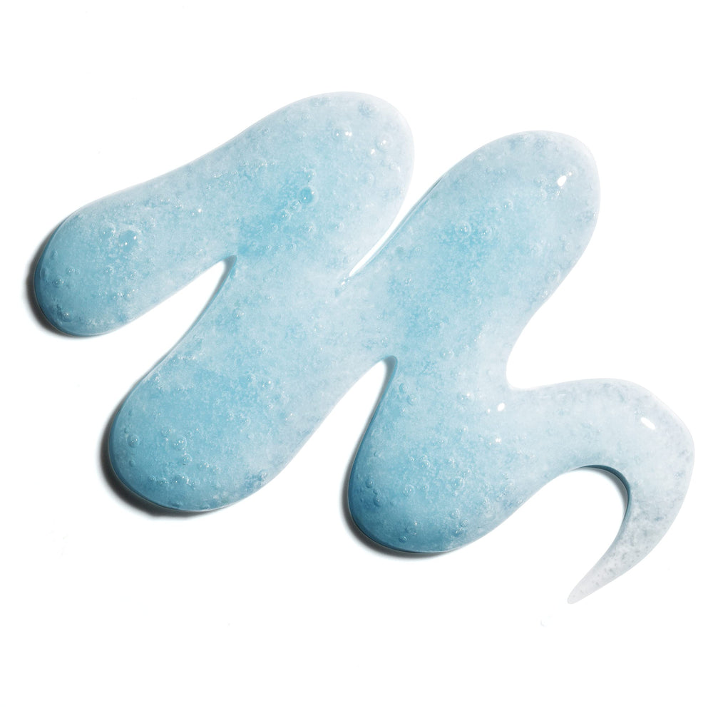 Murad Acne Body Wash salicylic-action shows pores being clarified during shower.