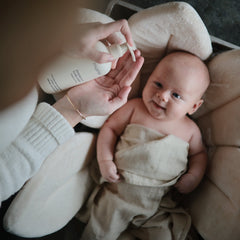 Bath-time scene with Mushie shampoo used for gentle cleansing of delicate skin