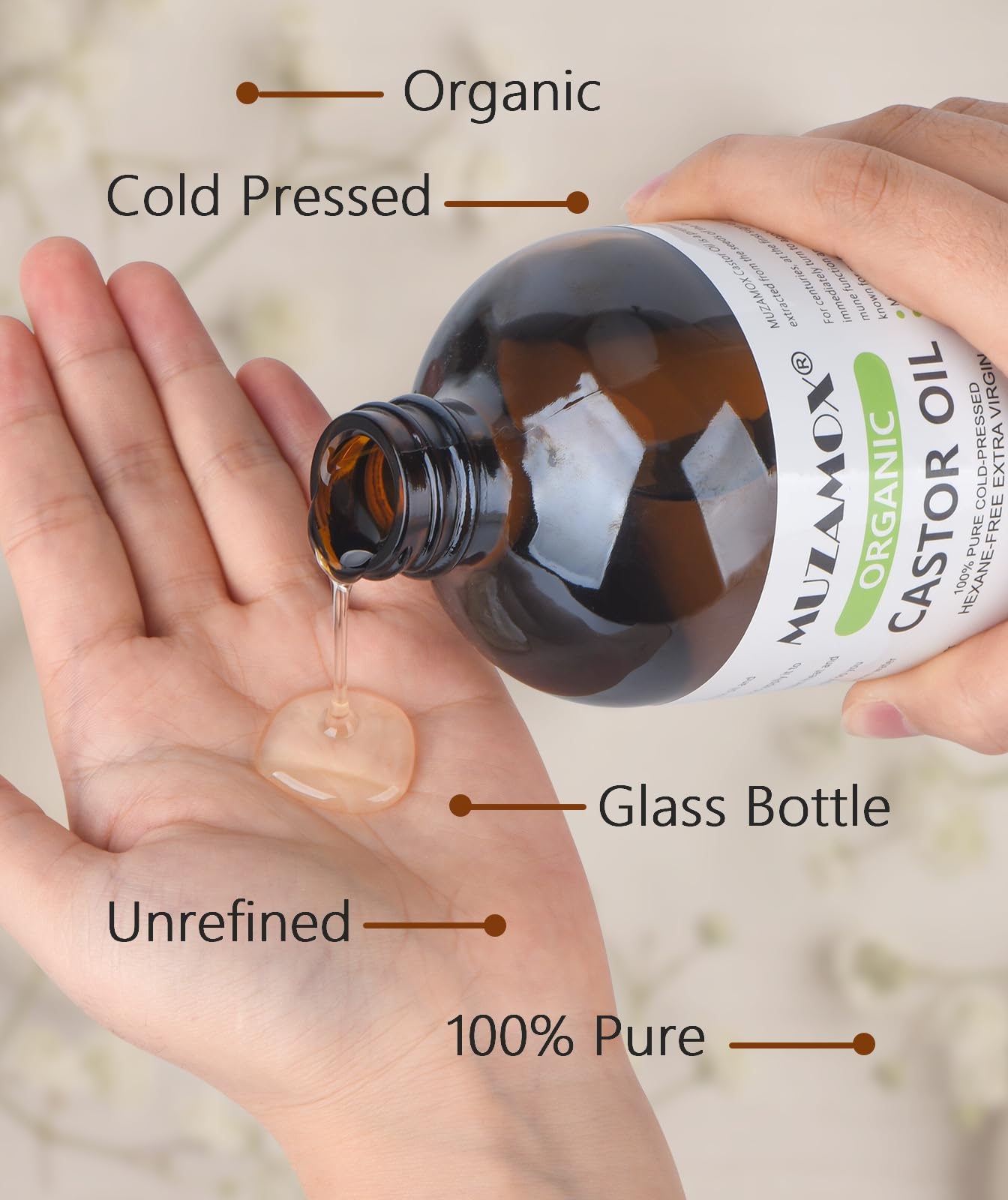 MUZAMOX cold-pressed castor oil on skin for nourishing hydration and soothing rituals