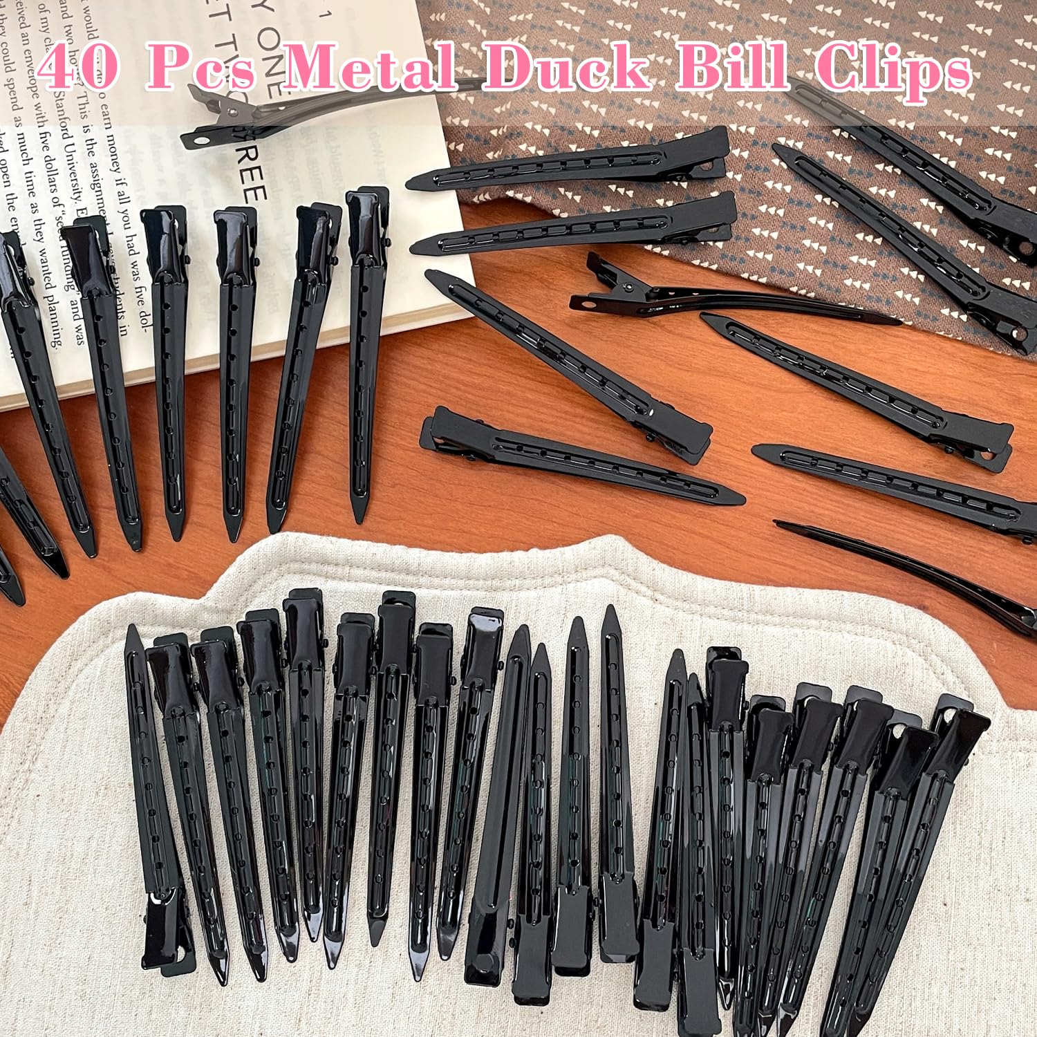 Mythos hair clip held in hand demonstrates portable styling tool.