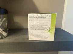 Myze lid wipe texture closeup showing soft, gentle cleansing action.
