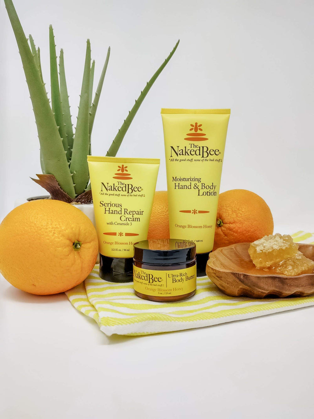 The Naked Bee barrier-repair hand cream in use demonstrates protection for dry skin.