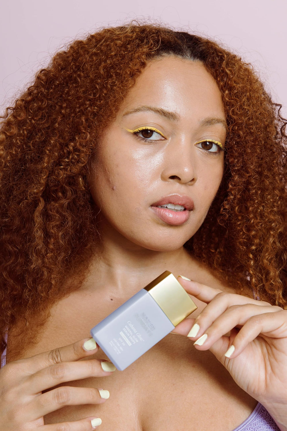 Naked Sundays CabanaGlow tube packaging closeup, travel-friendly sunscreen