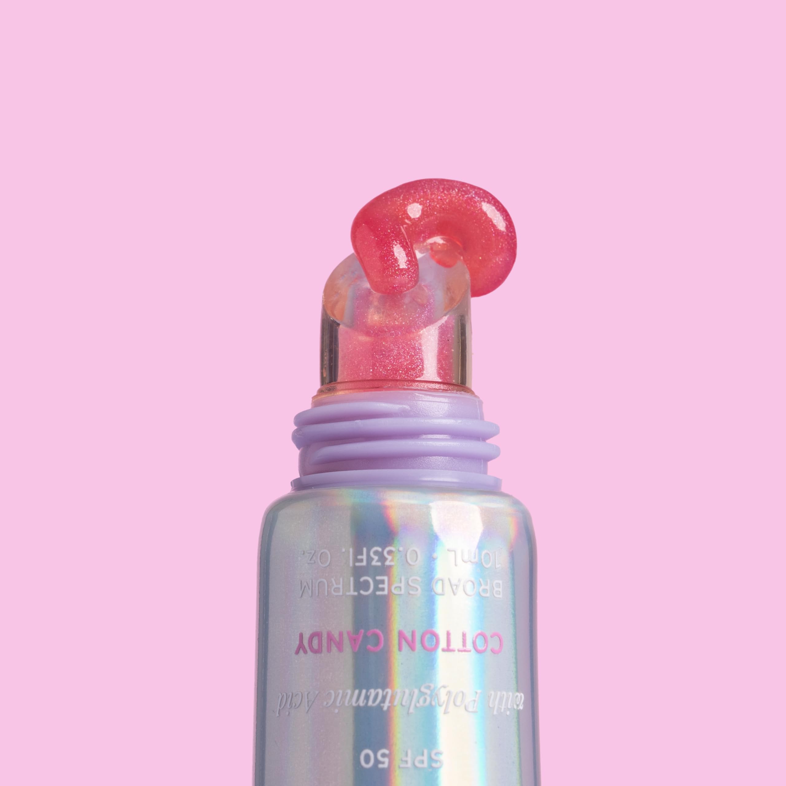 Naked Sundays PoutScreen lip application close-up highlights glossy finish.