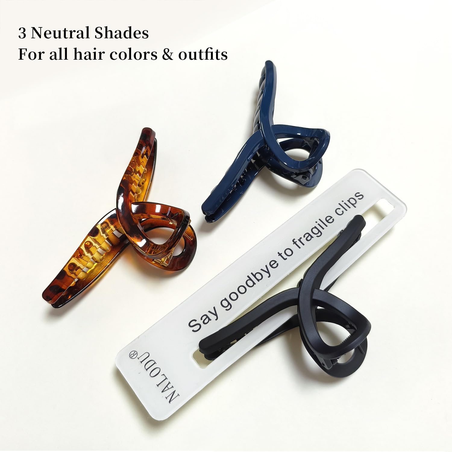 Nalodu hair claw clip large 4-inch butterfly navy blue complements denim and cool-toned looks.