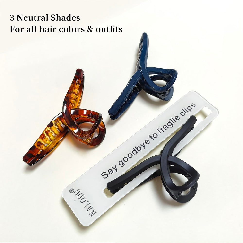 Nalodu hair claw clip large 4-inch butterfly navy blue complements denim and cool-toned looks.