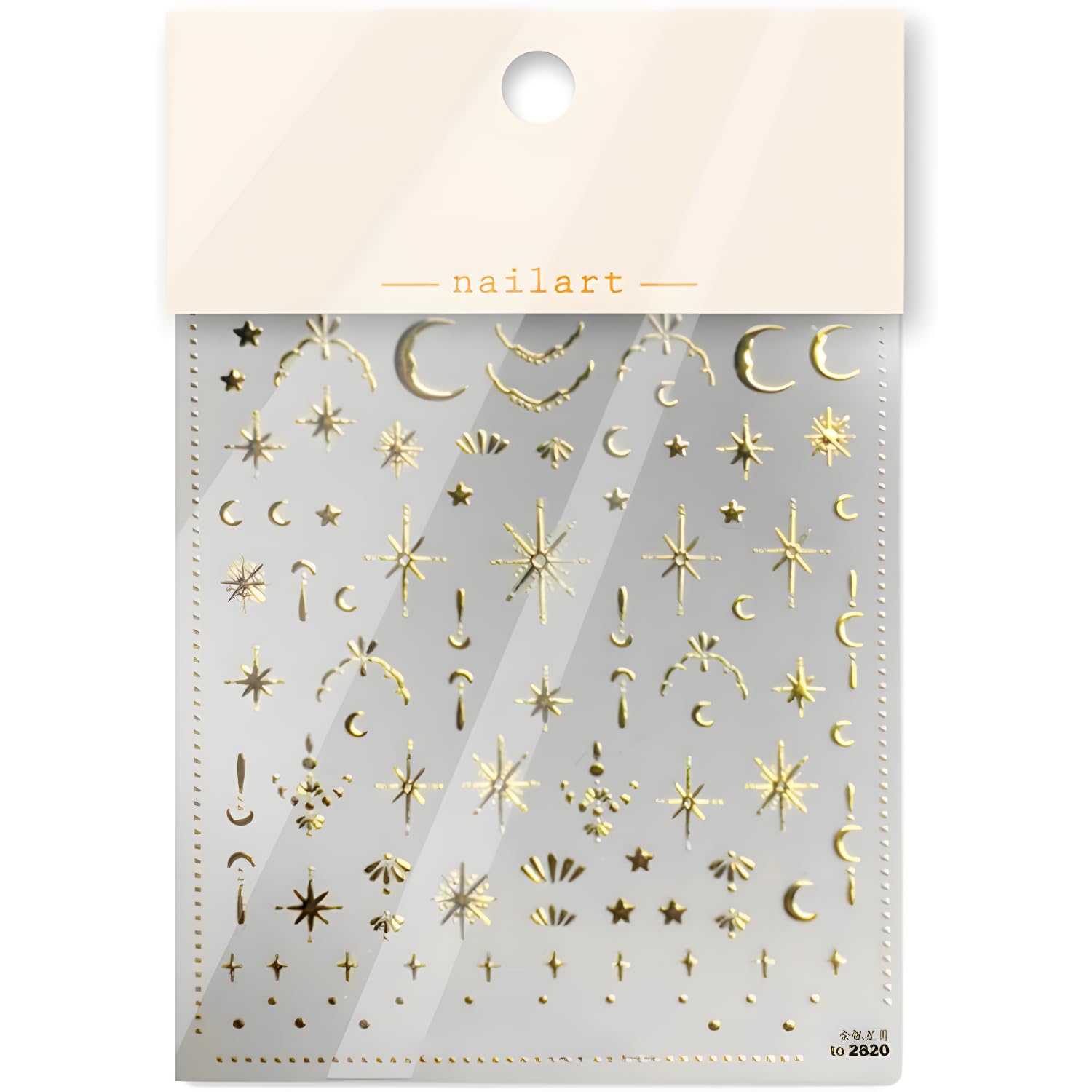 Namrec luxury gold nail stickers next to a manicure kit for home use.