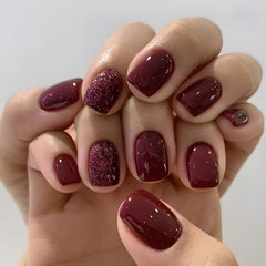 Namrec red press-on nails glitter design close-up with glossy red finish for quick at-home glam