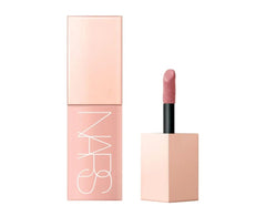 NARS Afterglow Liquid Blush Dolce Vita on cheek for a natural rosy glow and hydration.