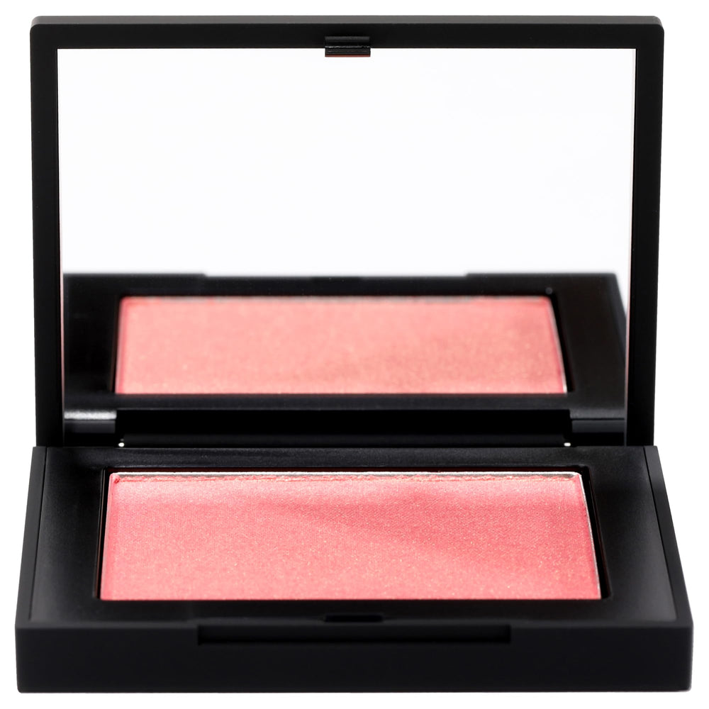 NARS Blush Orgasm swatch on skin shows peach-pink with golden shimmer, radiant cheeks