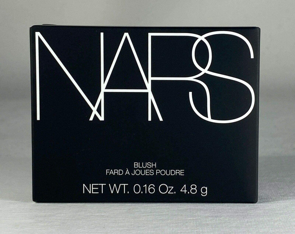 NARS Orgasm blush golden shimmer closeup to highlight festive glow.