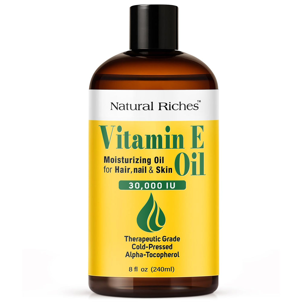 Natural Riches Vitamin E oil bottle close-up showing pure hydration for skin.