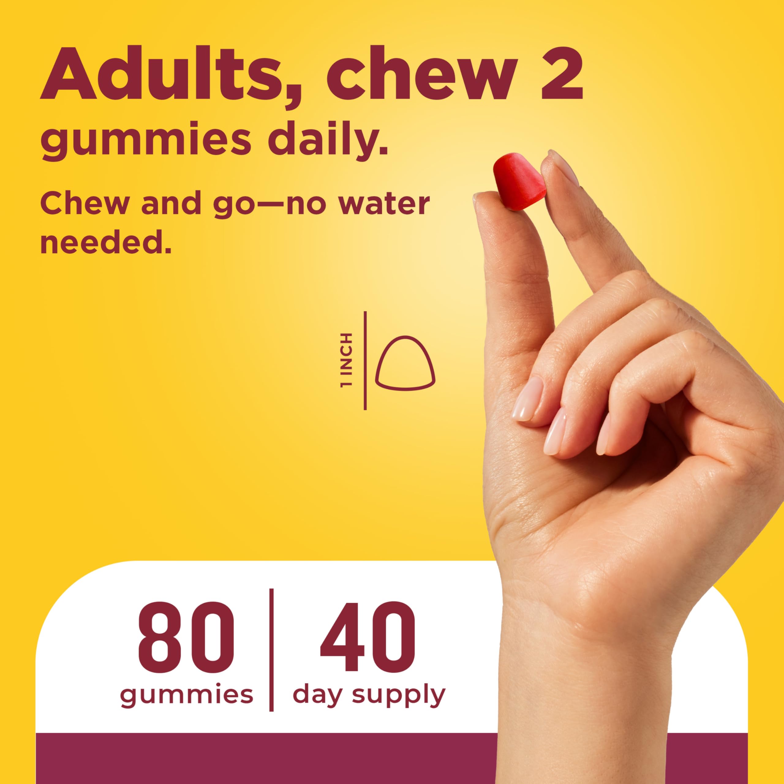 Nature Made two gummies in hand for scale, demonstrates serving size and portability