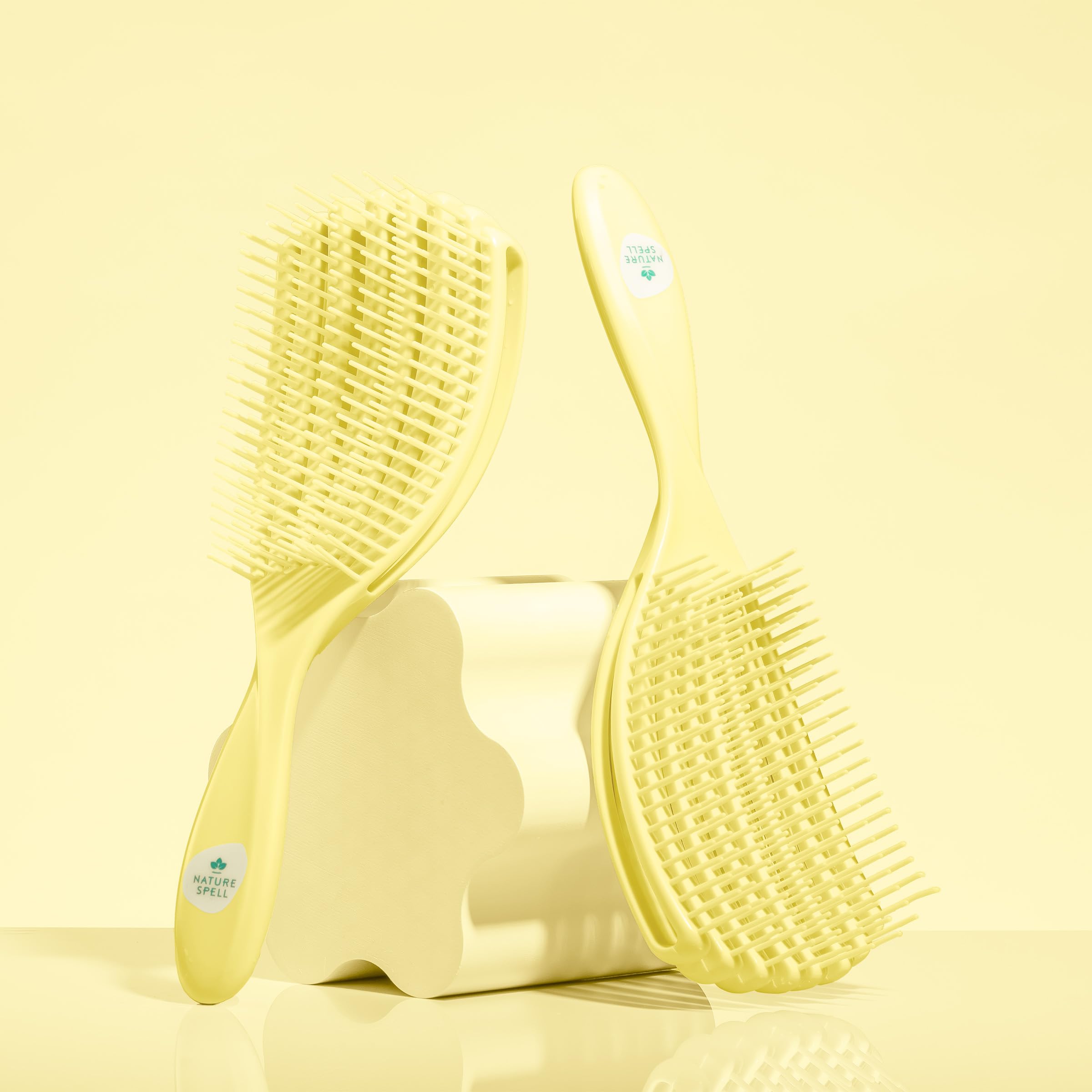 Nature Spell FlexiFlow Detangling Brush bristles close-up emphasizes gentle detangling.