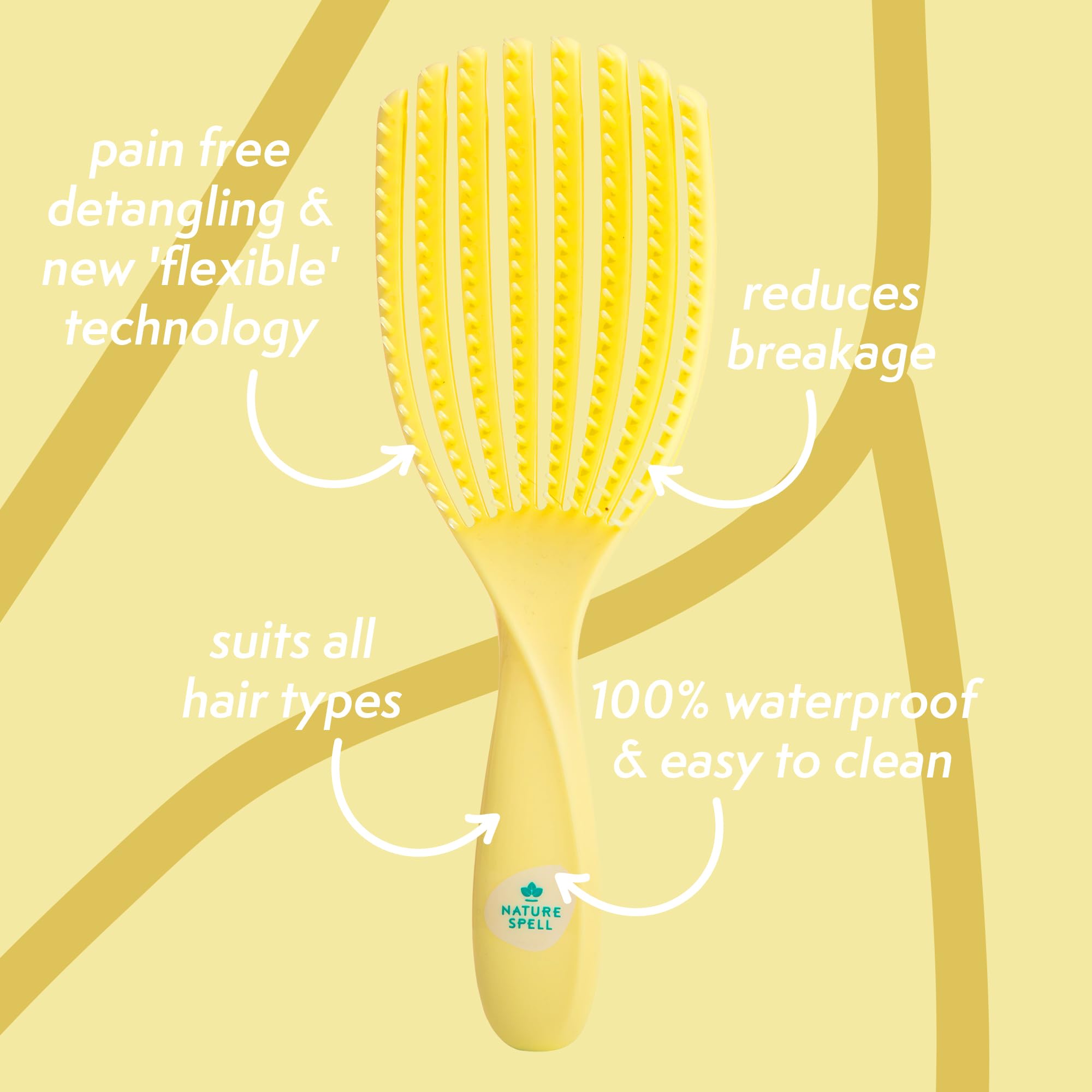 Nature Spell FlexiFlow Detangling Brush handle close-up highlights ergonomic grip.