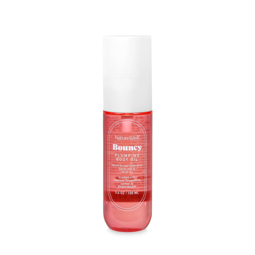 NATURE WELL Bouncy Plumping Body Oil bottle pour for fast-absorbing hydration and silky skin.