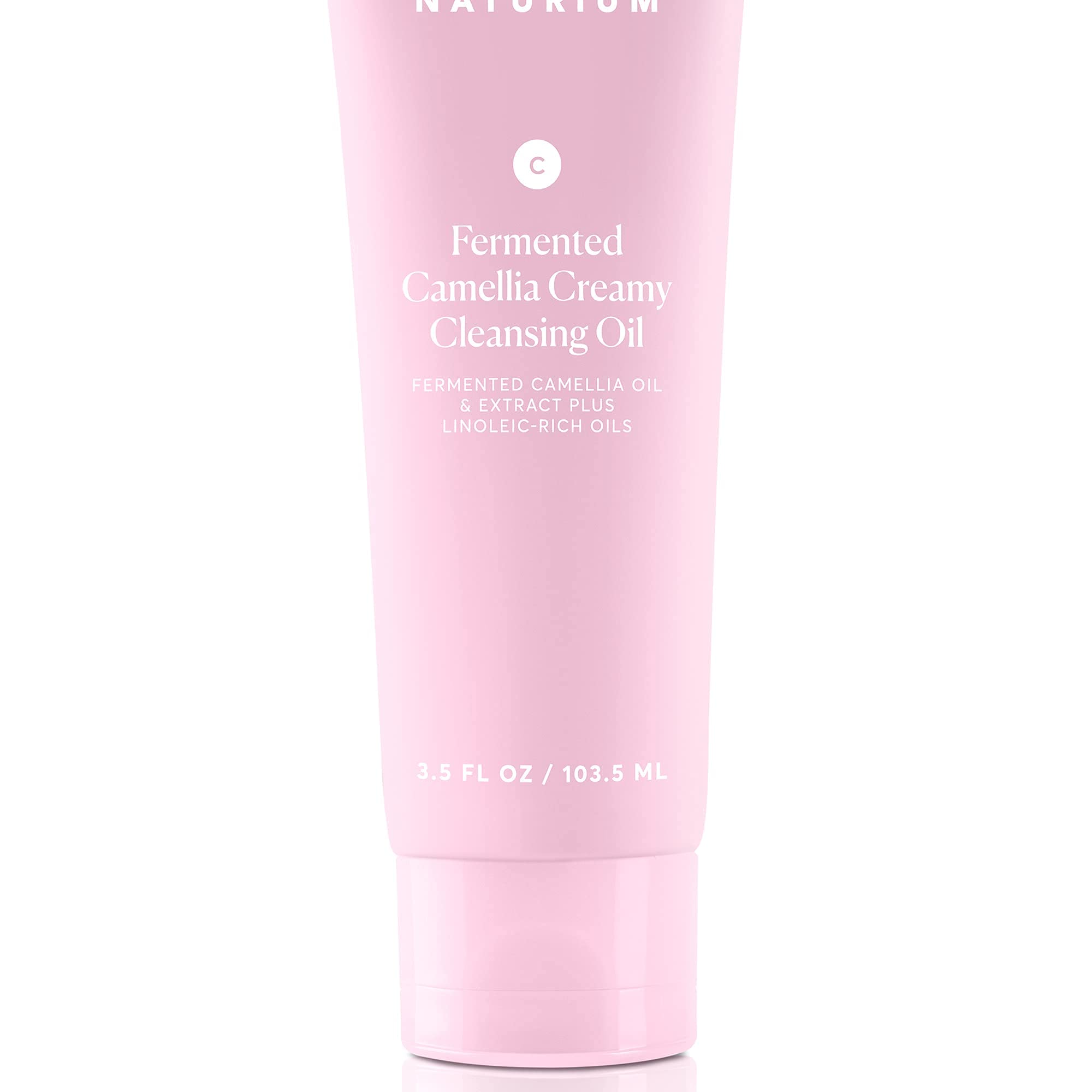 Naturium Camellia Cleansing Oil packaging highlights vegan and dermatologist-tested credentials.