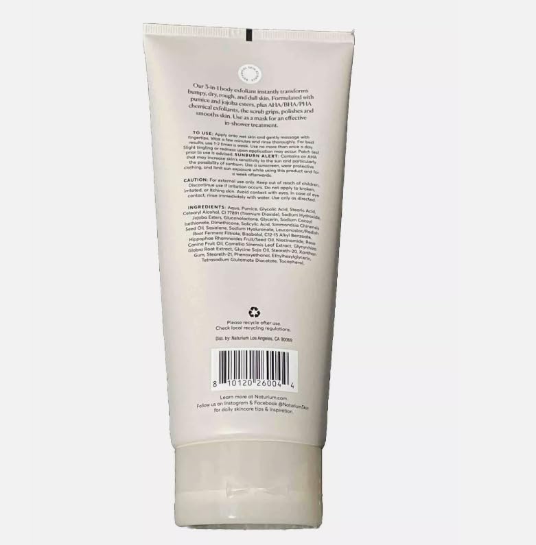 Naturium KP Body Scrub being applied to wet skin in shower