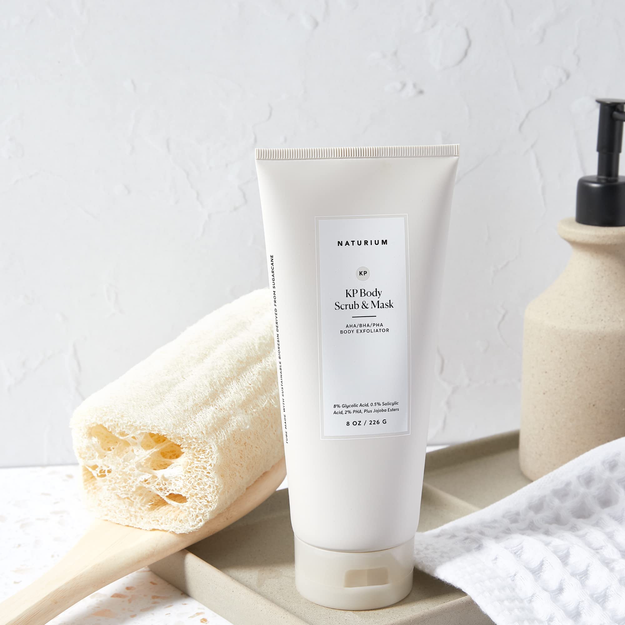 Naturium KP Body Scrub texture closeup showing creamy polish