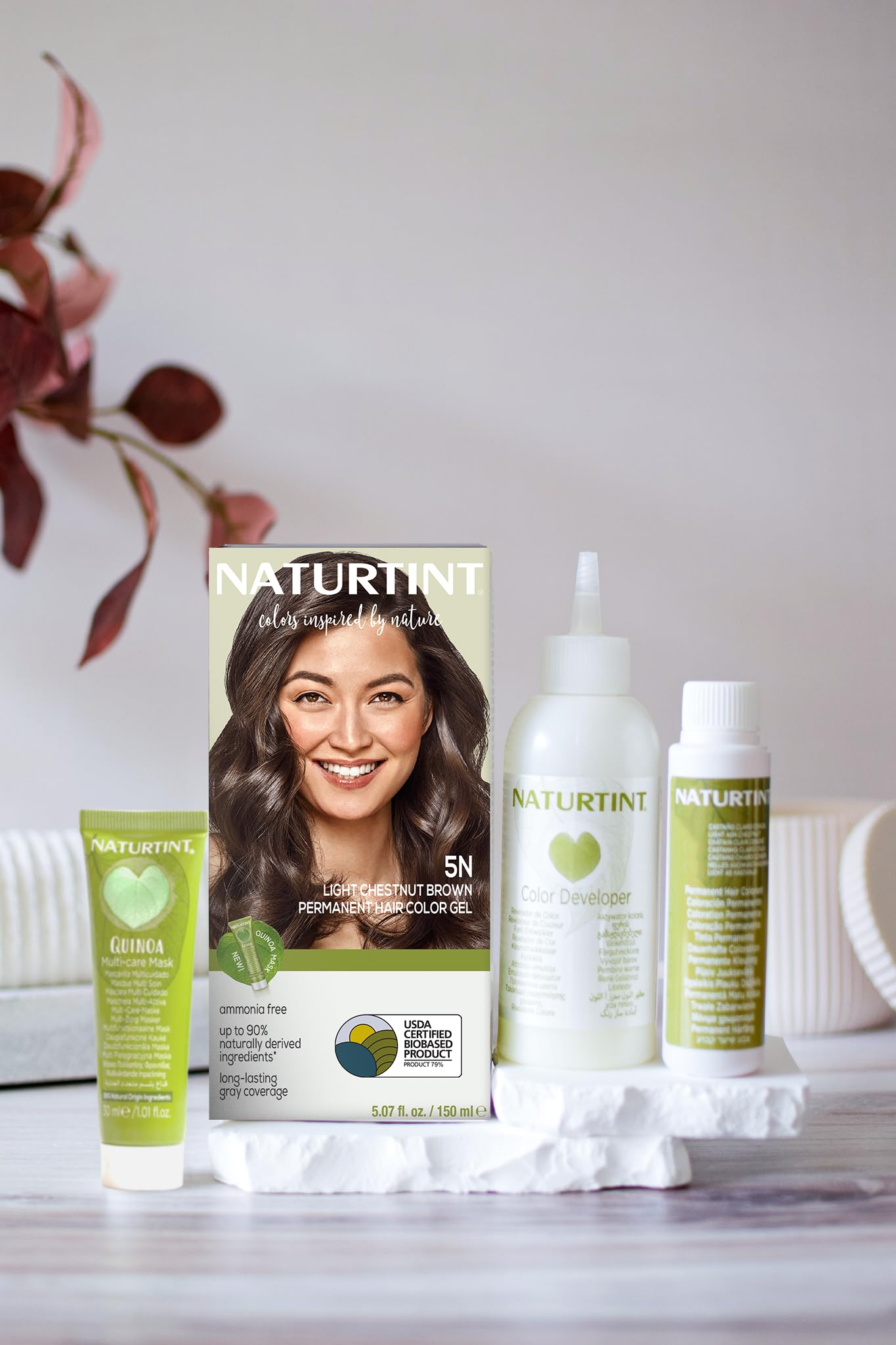 Naturtint plant-based formula bottle highlights nourishing care during color processing.