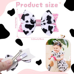 NCMAMA cow-pattern hair bow on a child demonstrating easy clipping for braids and ponytails.