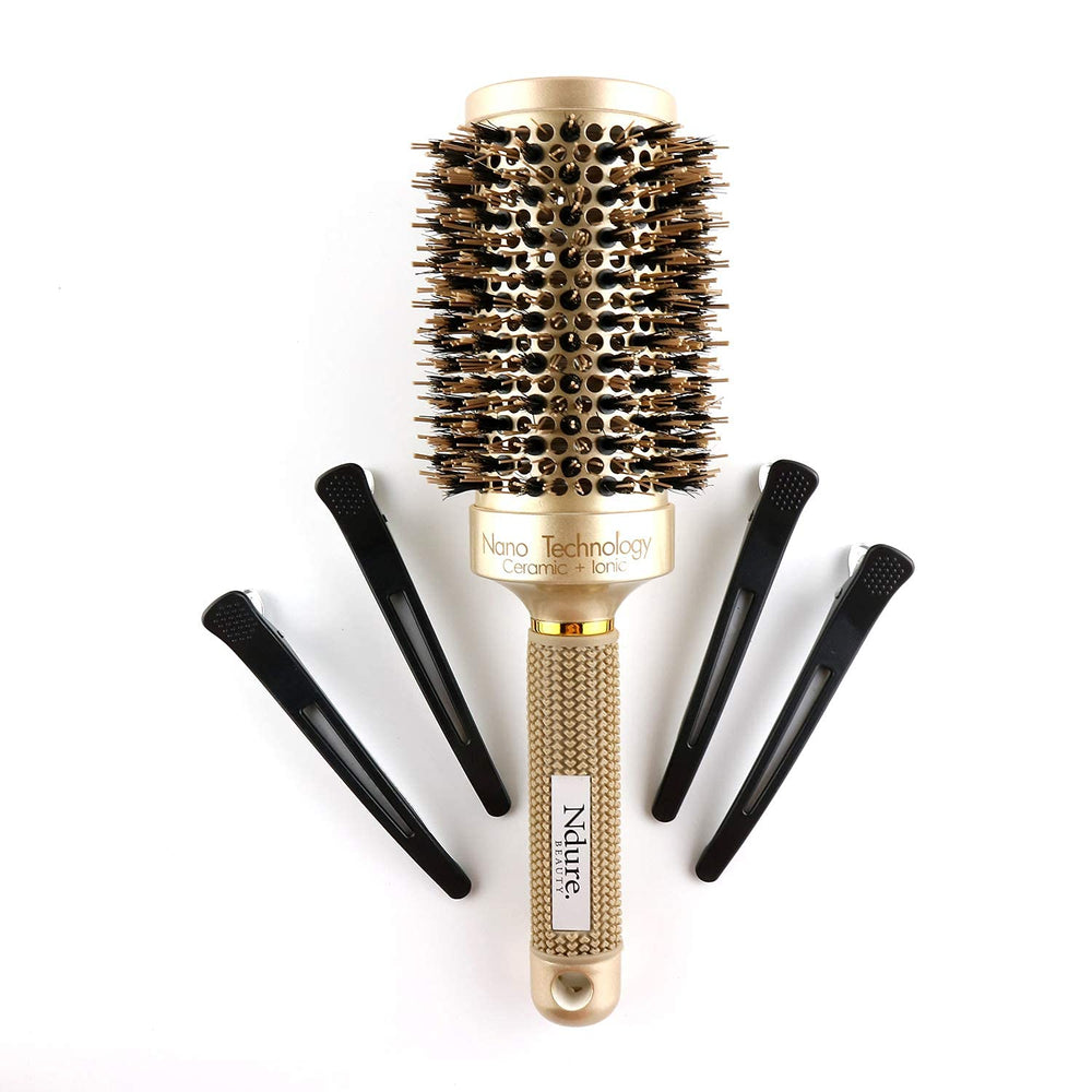 Ndure Beauty brush in use during blow drying for faster, even heat distribution