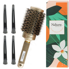 Ndure Beauty brush close-up highlighting boar bristles for detangling and shine