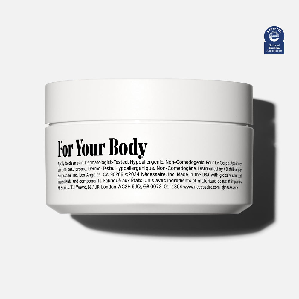 Nécessaire The Body Cream tub opened reveals thick, creamy texture.