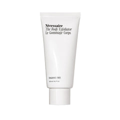 Nécessaire The Body Exfoliator bottle demonstrating gentle exfoliation for smoother skin.