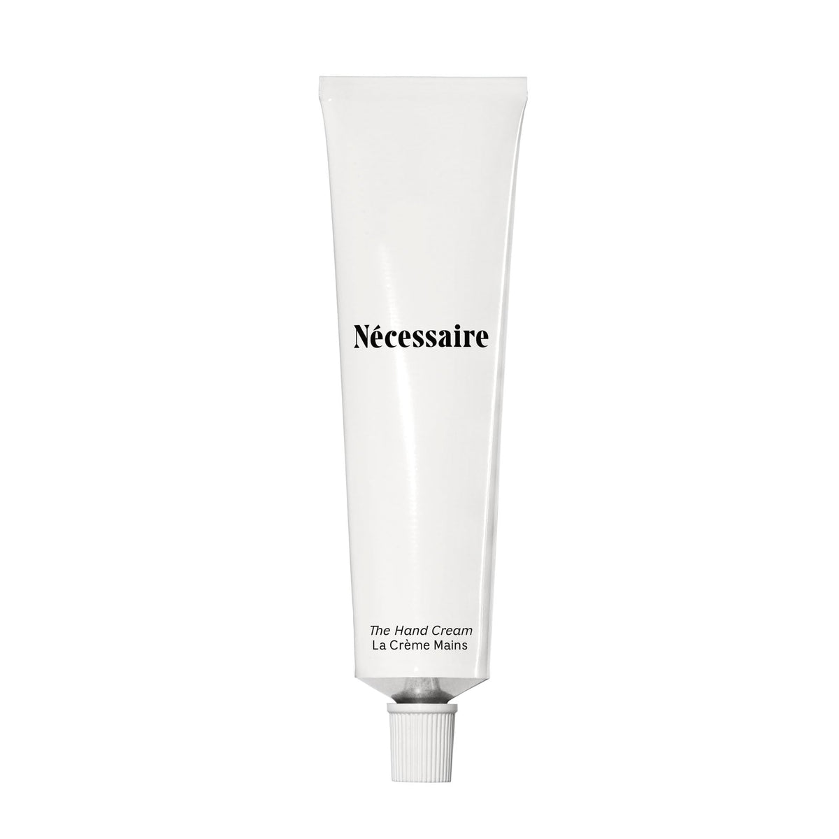 Nécessaire Hand Cream application close-up showing smooth texture and quick absorption.