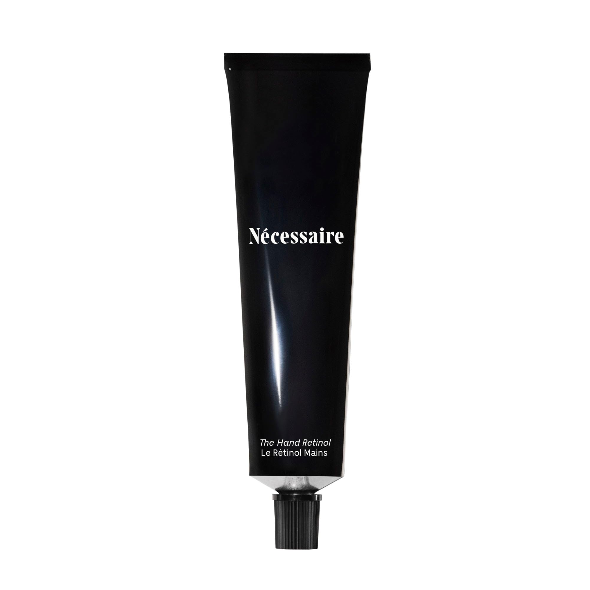 necessaire hand retinol bottle close-up for nightly repair benefits
