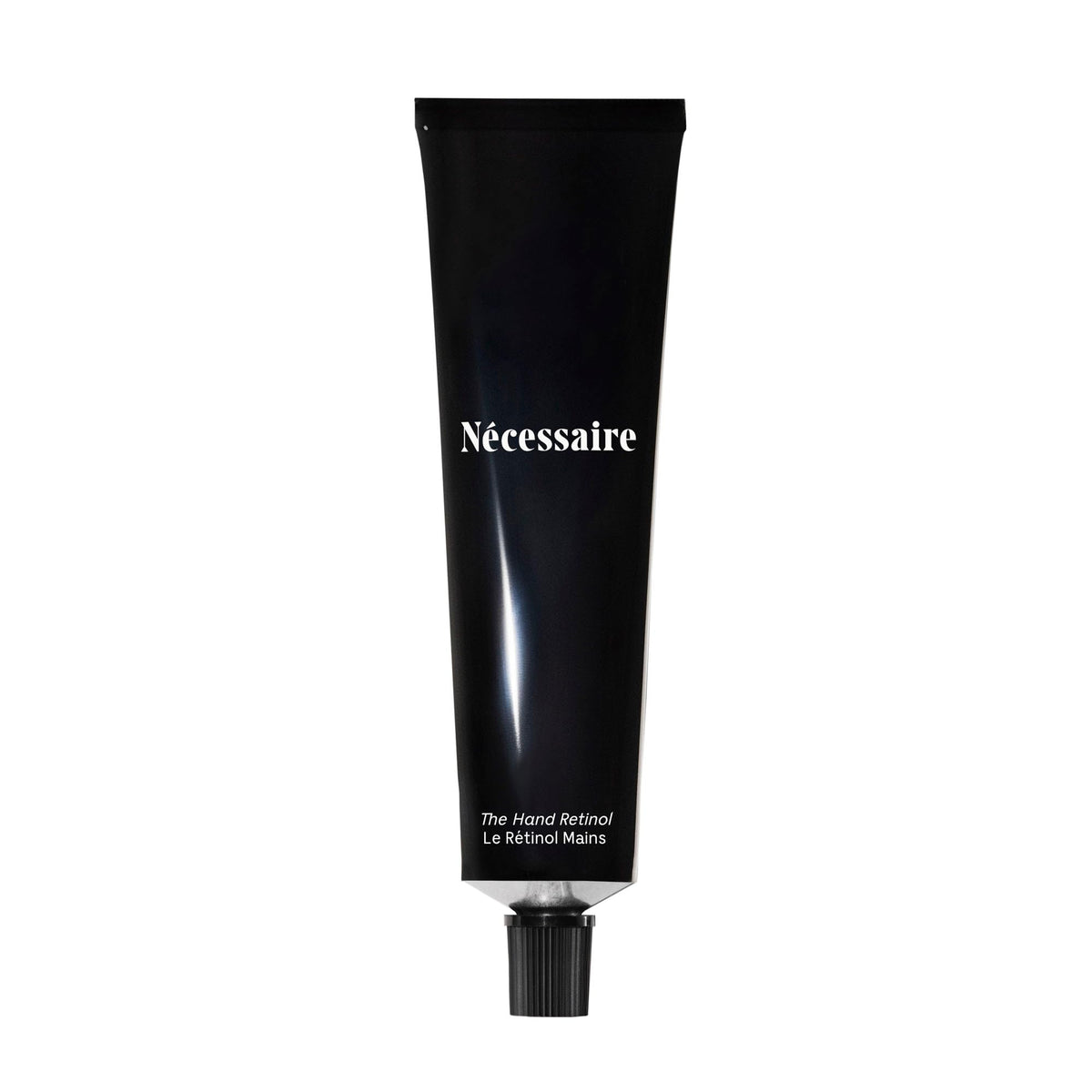 necessaire hand retinol bottle close-up for nightly repair benefits