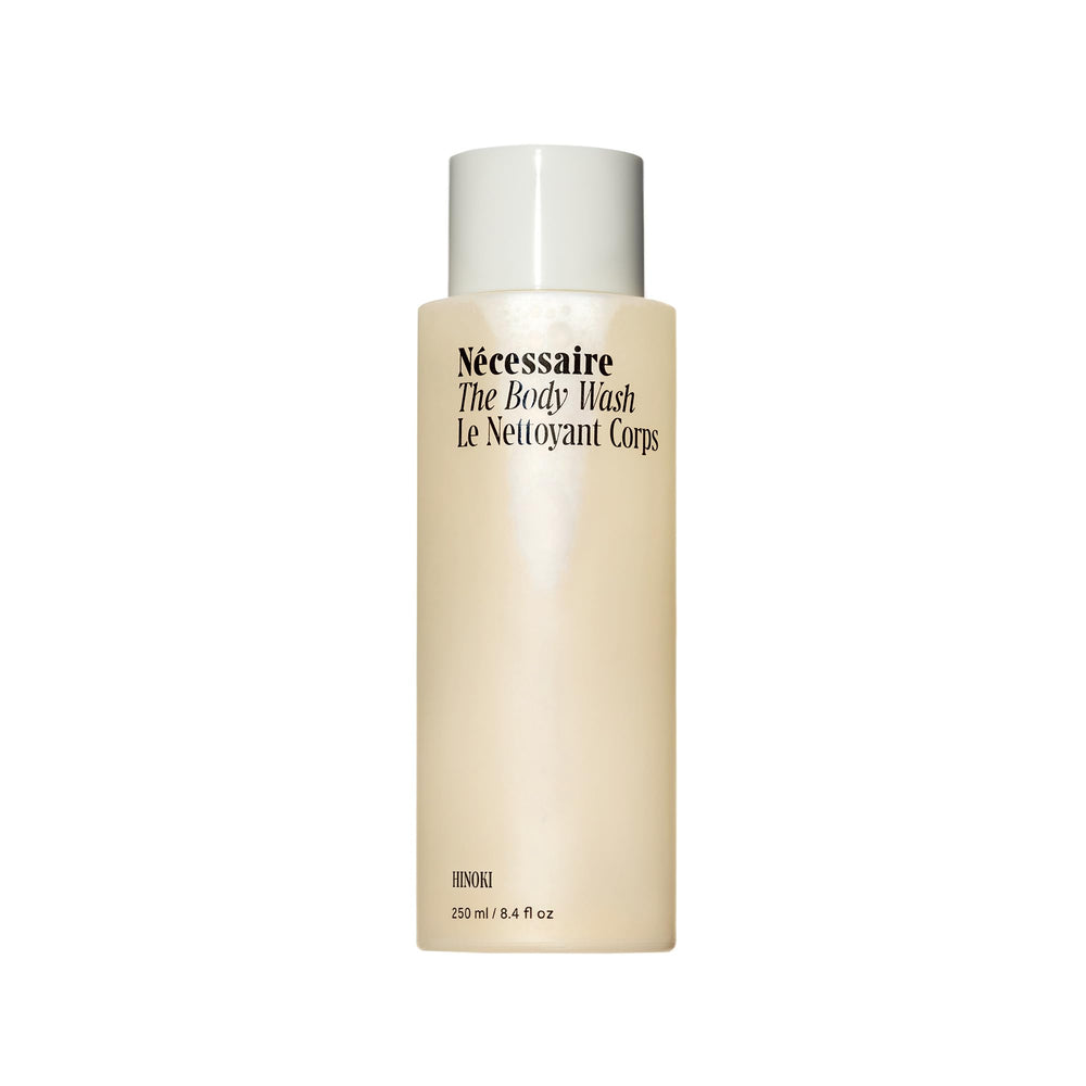 Nécessaire Hinoki body wash bottle closeup showing nourishing oils for dry skin