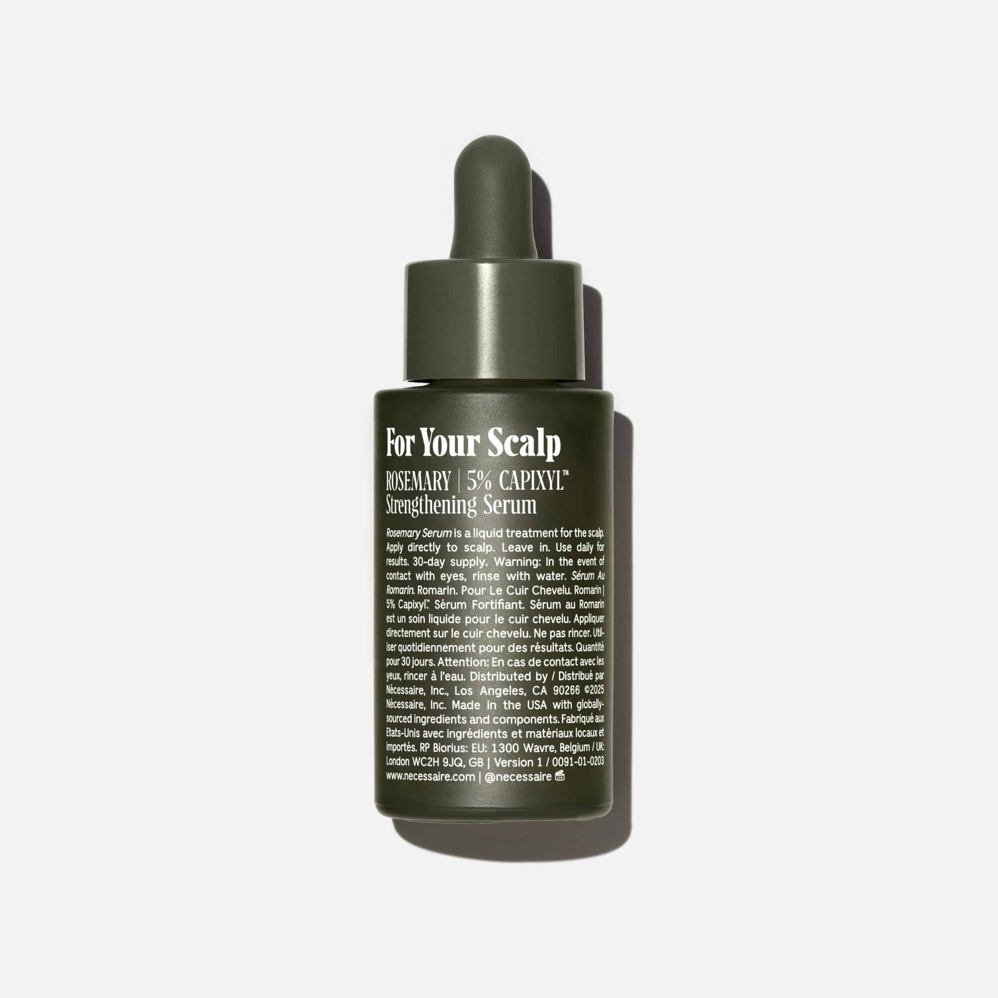 Nécessaire Rosemary Serum being applied to scalp for quick-dry, no-residue results.